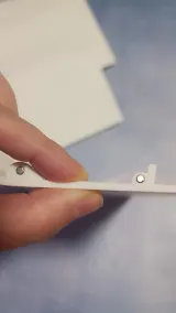 Upper back bed cover segment held in hand, side profile