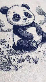 Navy and white knitted baby blanket with the panda bear design
