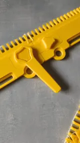 Yellow cast-on comb segment with connector clip