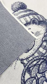 Close-up of the hedgehog jacquard blanket fabric, reverse side