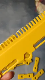 Yellow cast-on comb segment and weight clips