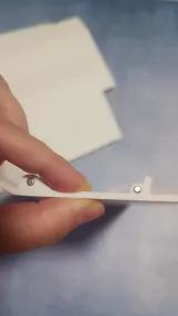 Upper back bed cover segment held in hand, side profile