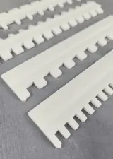 Close-up of the slots on the needle selectors for 7-gauge Silver Reed machines