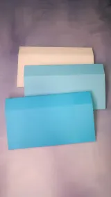 Upper back bed covers in cream, light blue and blue