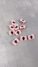 Pink needle bed markers with black arrows