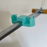 Mint paraffin wax holder mounted on the yarn mast of a Silver Reed knitting machine