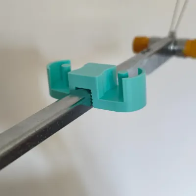 Mint paraffin wax holder mounted on the yarn mast of a Silver Reed knitting machine